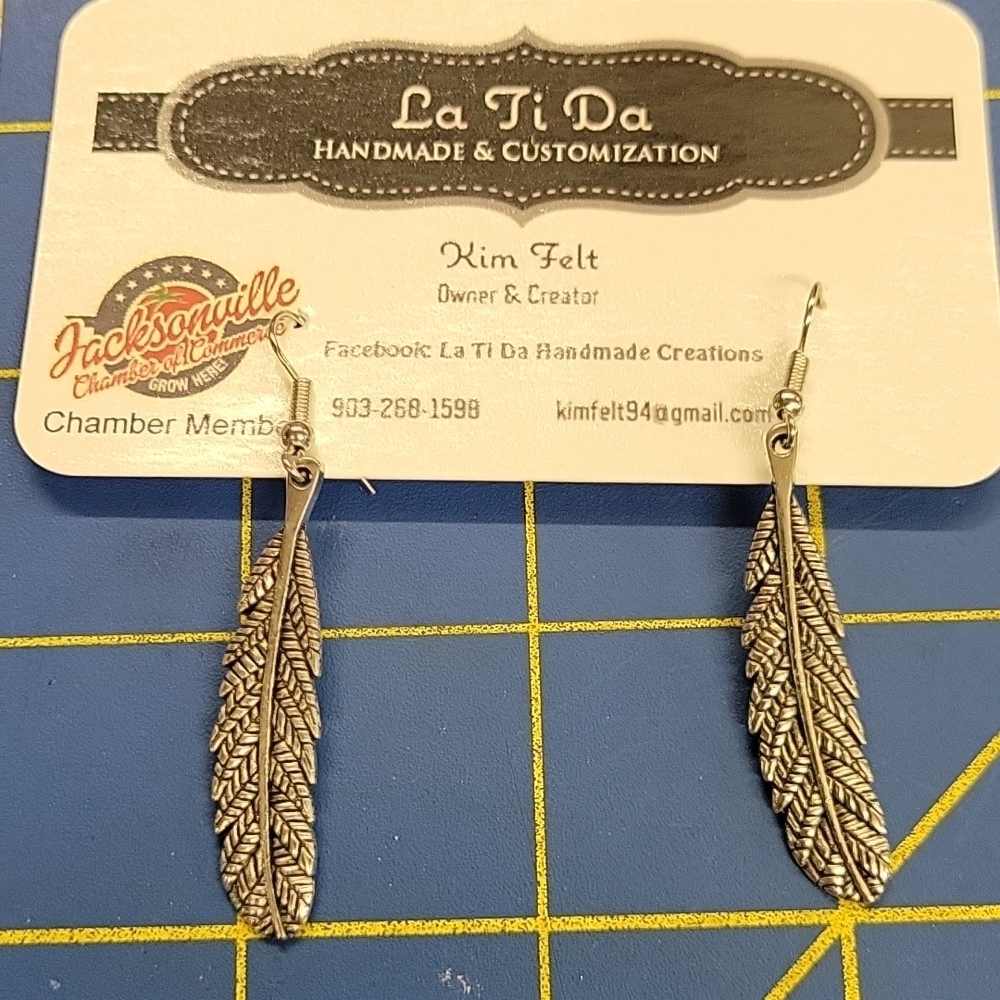 Silver Tone Dangle 1.5" Earrings - Feather Design